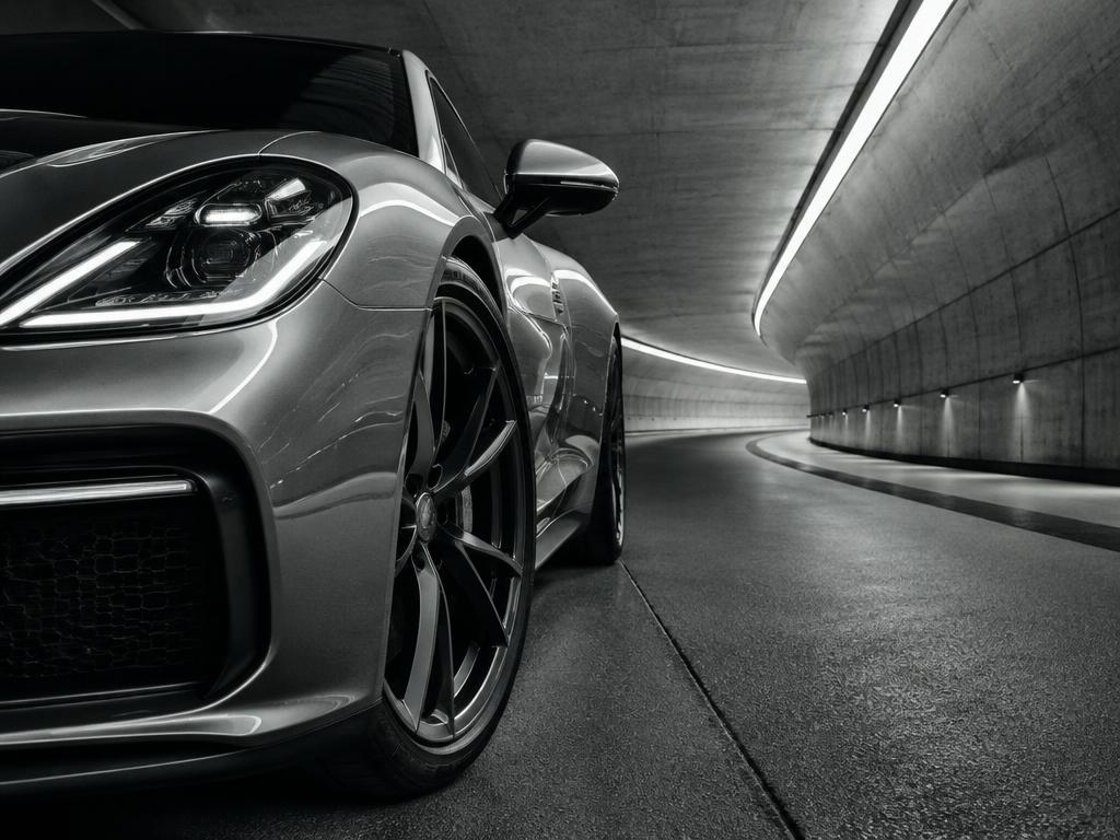 Silver motor vehicle in a contemporary tunnel